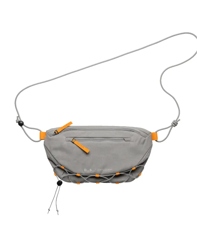 Roamer Pro Sling Bag 6L Sand Grey made by Dooney & Bourke
