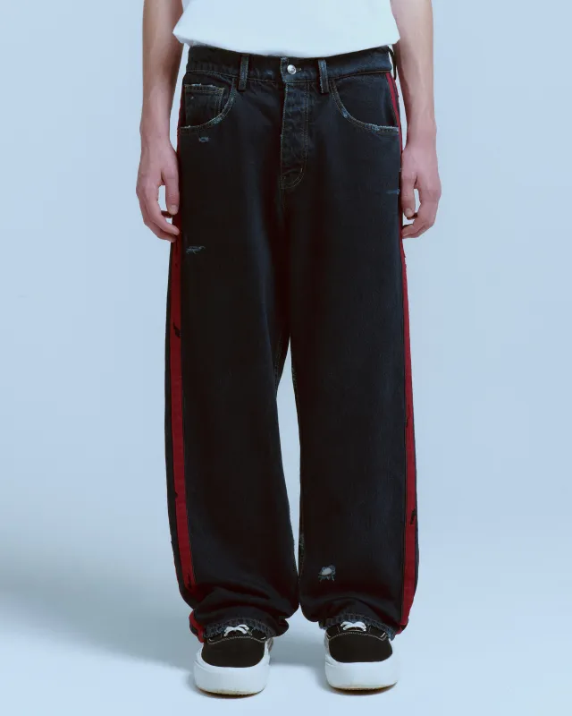 DESTROYED DENIM TRACK PANT made by Nahmias