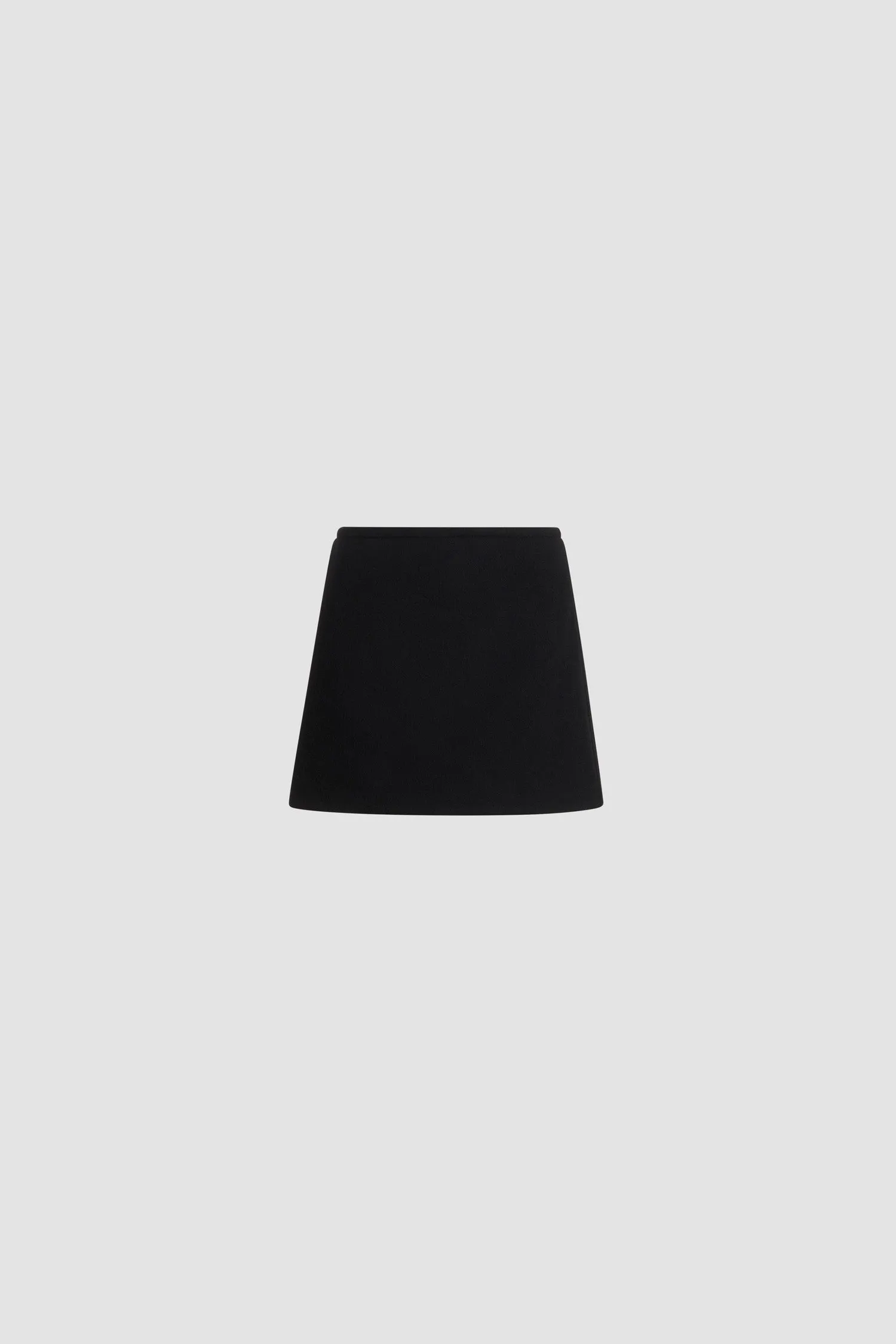 A-line mini skirt in sustainable wool blend sold by Patou