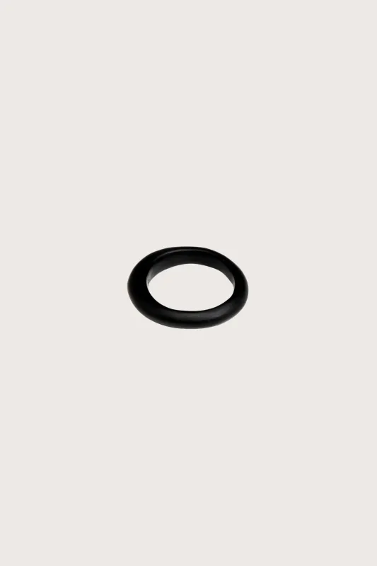 Dinosaur Designs Small Organic Bangle in Black made by Dinosaur Designs