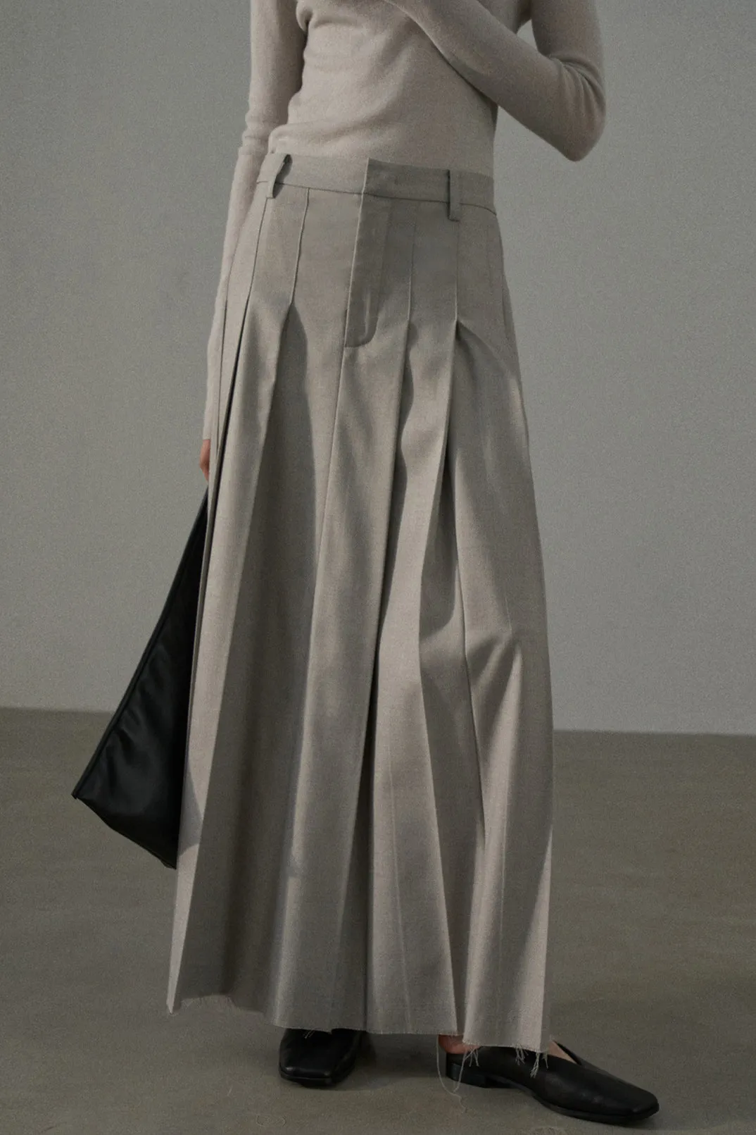 Flattering pleated raw-edge finish A-line skirt | 4 color sold by Polyphonie