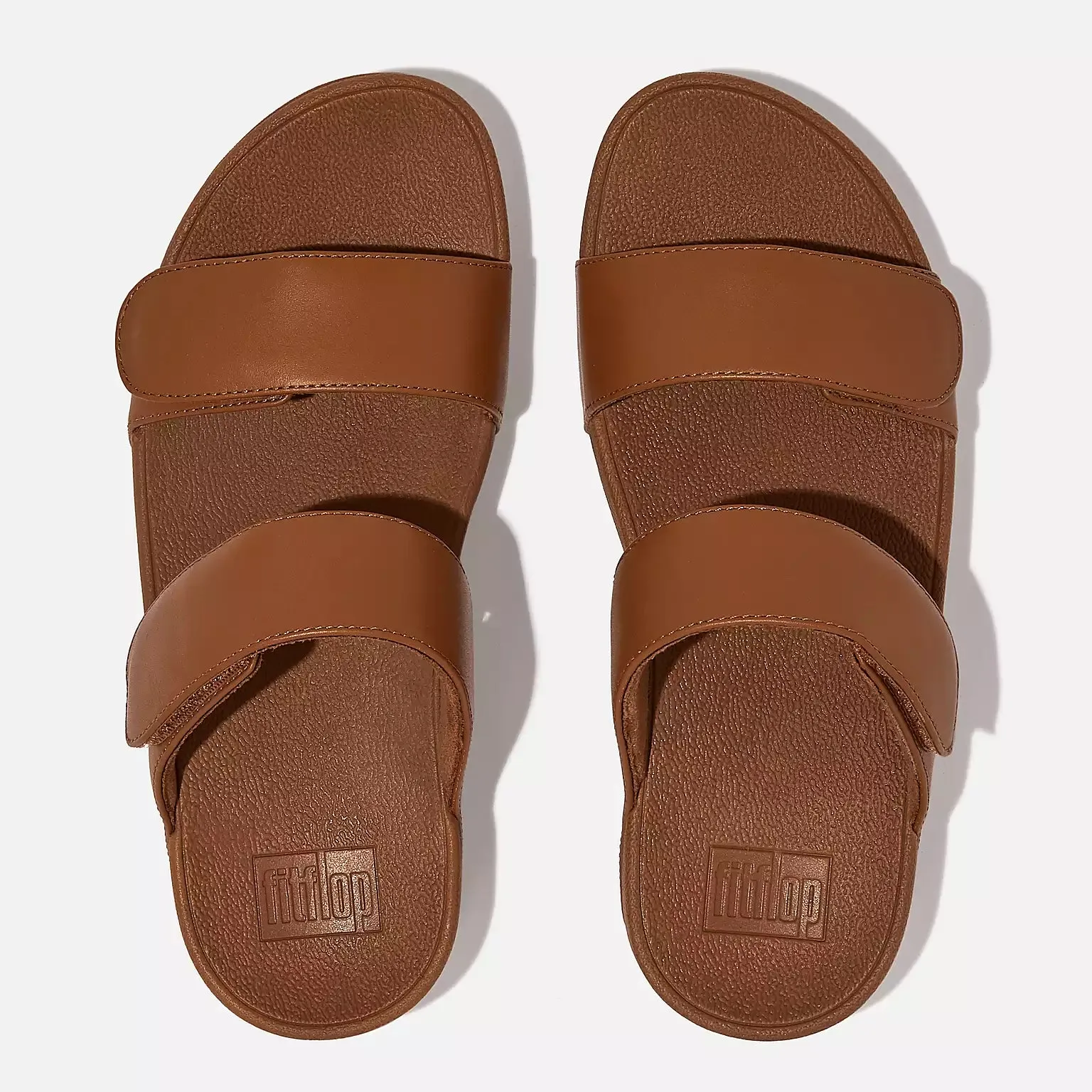 FitFlop Women's Lulu Adjustable Leather Slides Light Tan sold by Orleans Shoe Co.