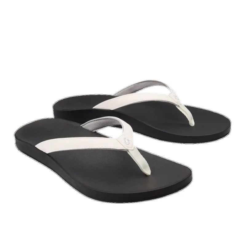 Olukai Women’s Puawe White Black sold by Orleans Shoe Co.