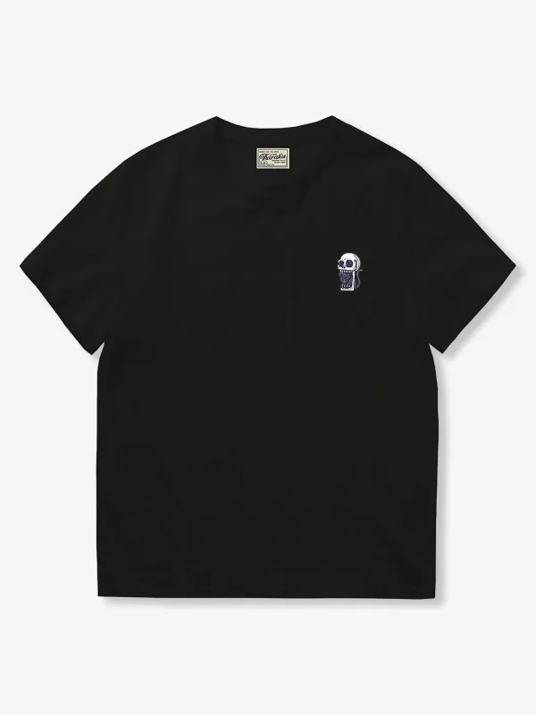 “Mischievous Cat Playing with Skeleton” Embroidered T-Shirt sold by Karaku