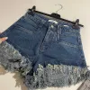 OPAL High Waisted Frayed Edge Acid Wash Denim Shorts in Candy Pink sold by Talliah Rose UK