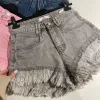 OPAL High Waisted Frayed Edge Acid Wash Denim Shorts in Candy Pink sold by Talliah Rose UK