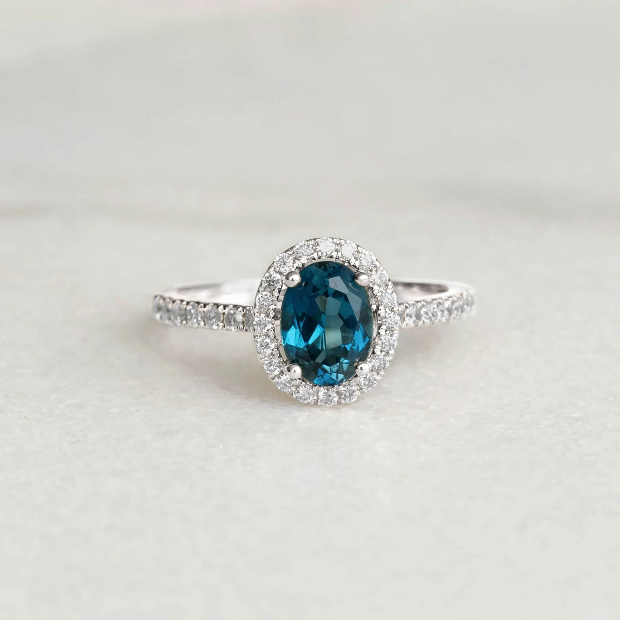 Oval London Blue Topaz Halo Ring White Gold - Suna sold by Linjer
