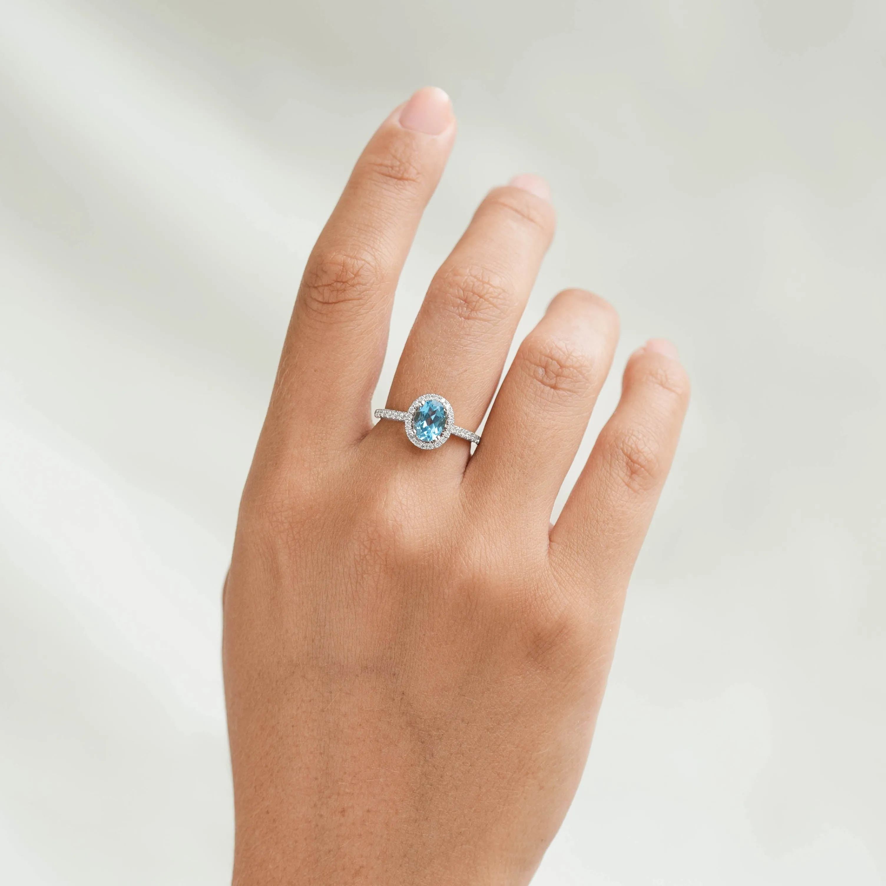 Oval Swiss Blue Topaz Halo Ring White Gold - Suna sold by Linjer product image thumbnail 2