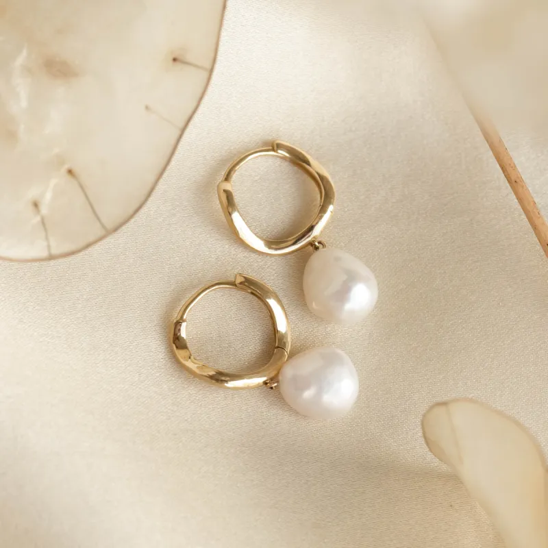 Baroque Pearl Twist Huggie Earrings 14k Gold sold by Linjer