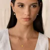 Baroque Pearl Twist Huggie Earrings 14k Gold sold by Linjer