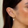 Baroque Pearl Twist Huggie Earrings 14k Gold sold by Linjer
