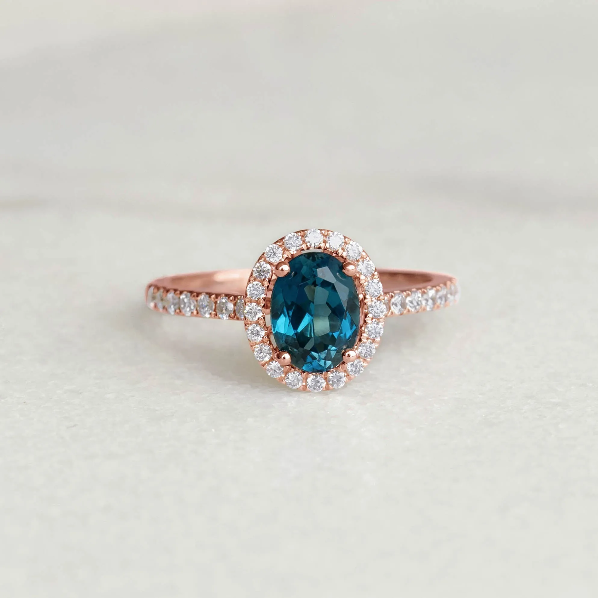 Oval London Blue Topaz Halo Ring Rose Gold - Suna sold by Linjer