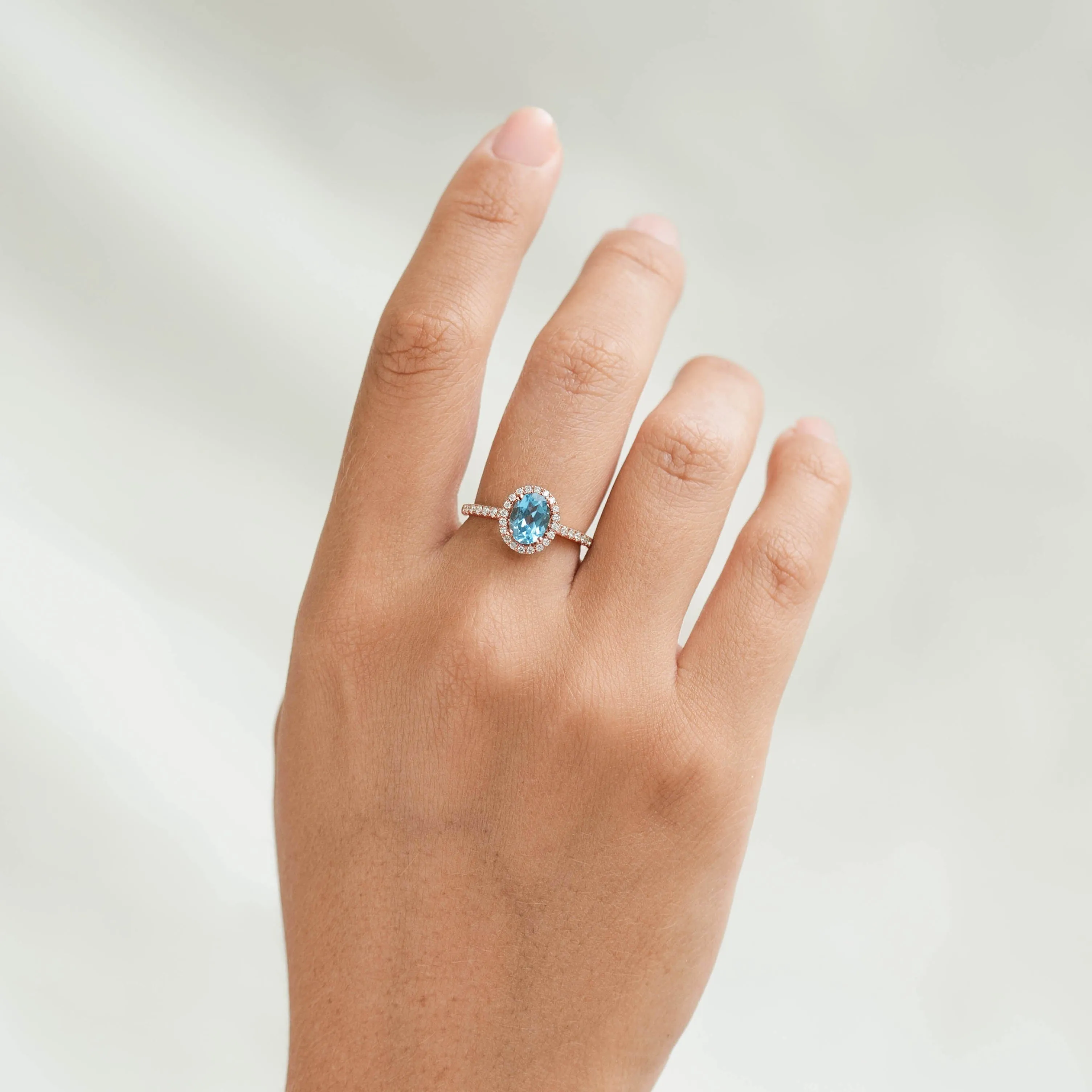 Oval Swiss Blue Topaz Halo Ring Rose Gold - Suna sold by Linjer product image thumbnail 2