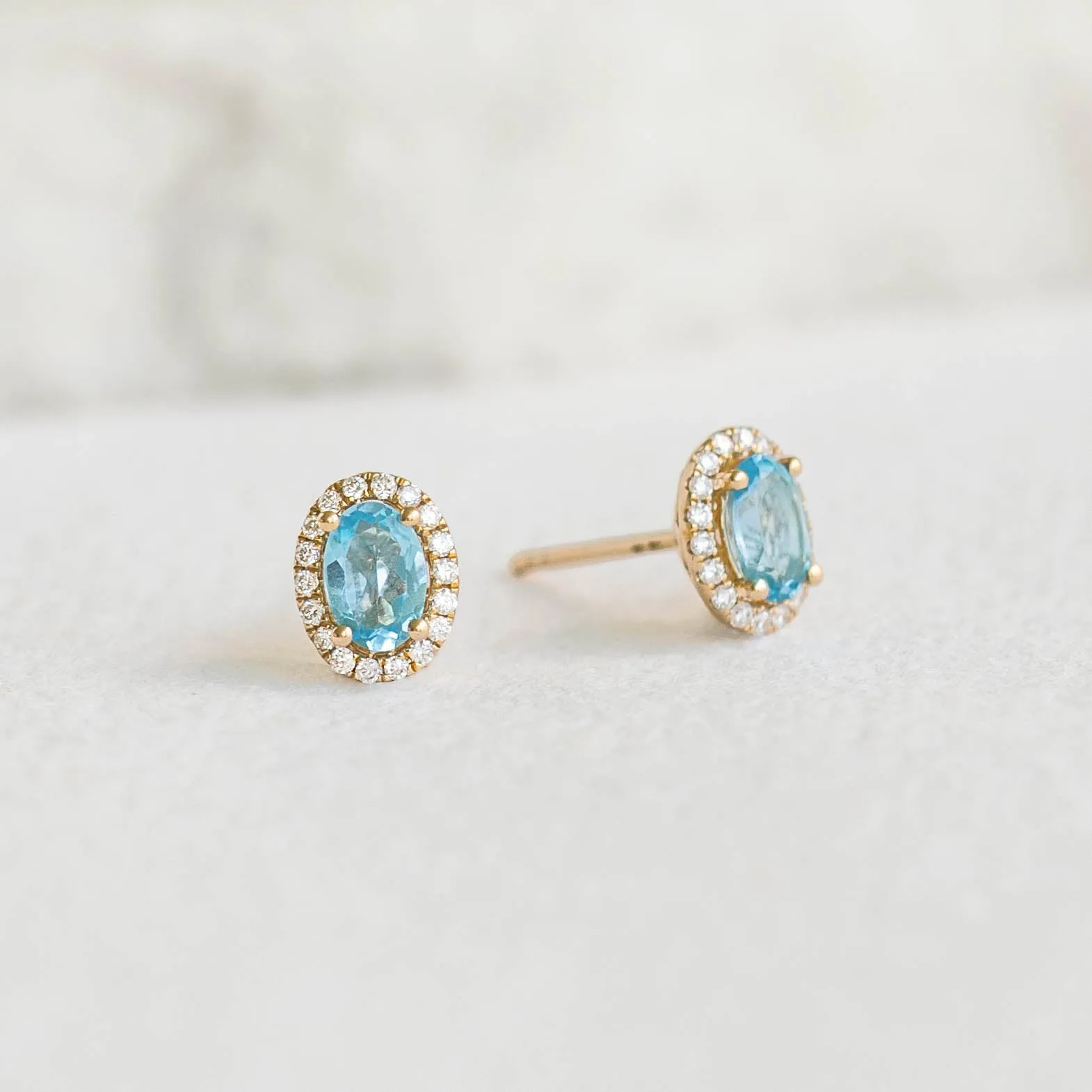 Swiss Blue Topaz Halo Stud Earrings 14k Gold - Marzia sold by Linjer