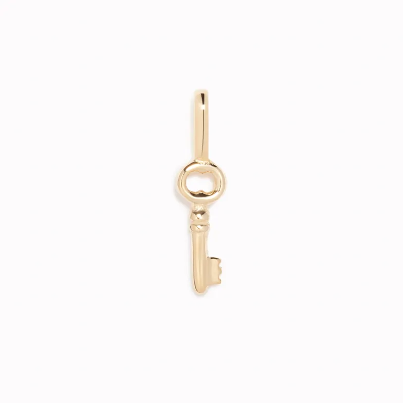 Key Charm 14k Gold sold by Linjer