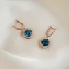 London Blue Topaz and Diamond Halo Drop Earrings Rose Gold - Elvira sold by Linjer