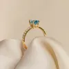 Oval Swiss Blue Topaz and Diamond Ring 14k Gold - Minette sold by Linjer