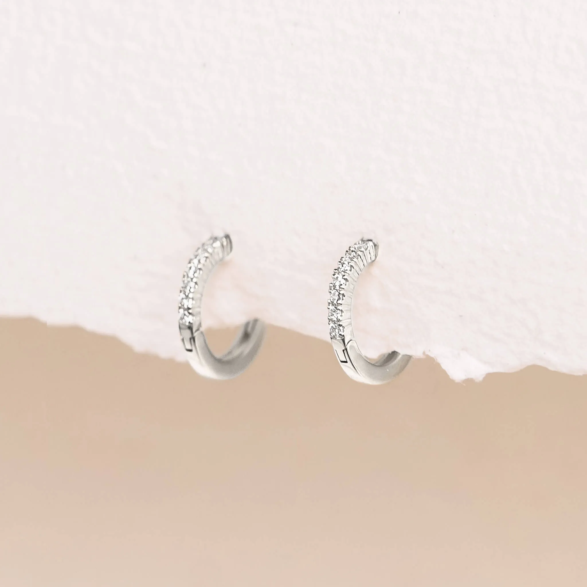 14k White Gold Diamond Huggie Earrings - Susanna sold by Linjer