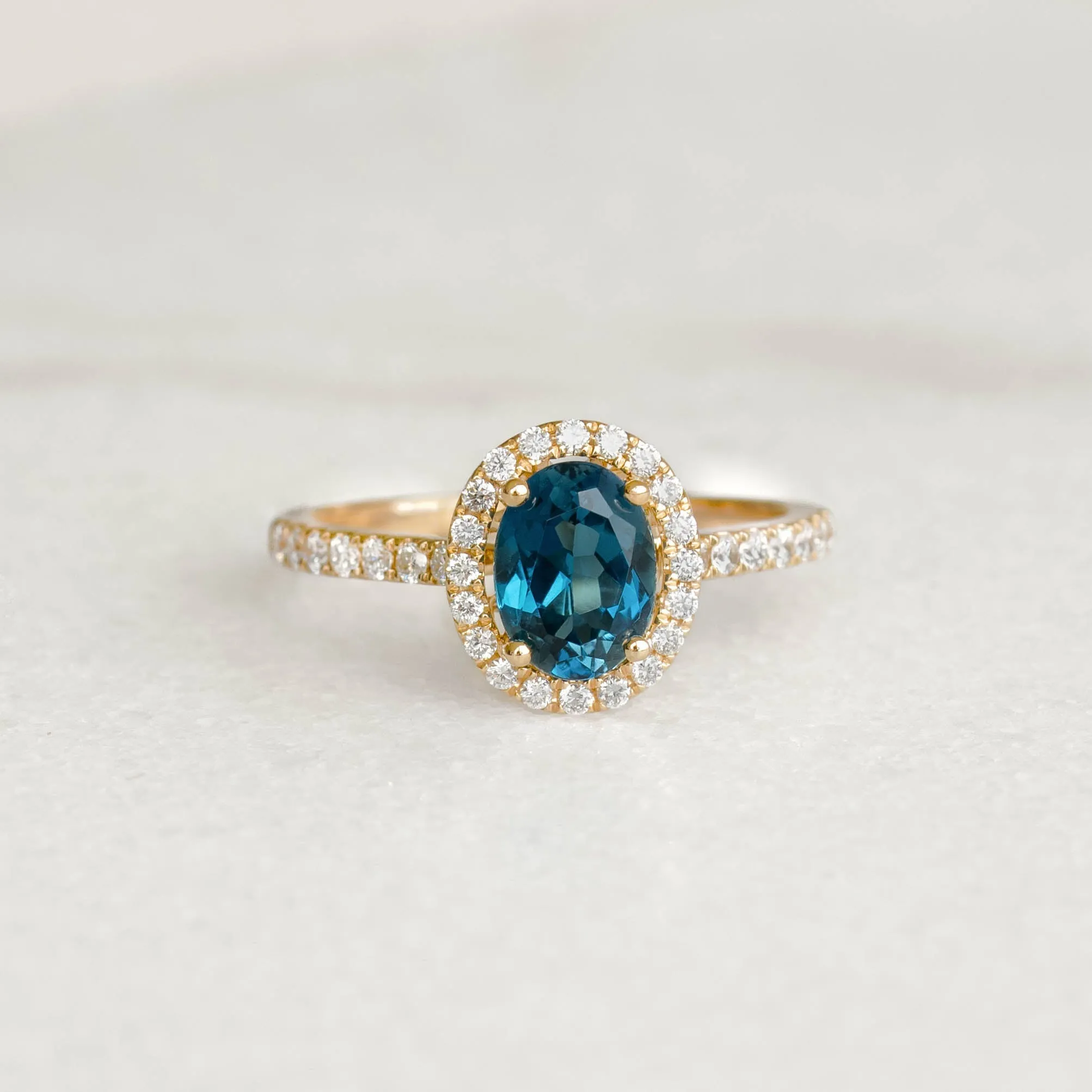 Oval London Blue Topaz Halo Ring 14k Gold - Suna sold by Linjer