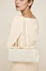 Gold Ivory Éclair Bag sold by VERAFIED