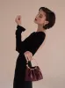 Burgundy Ring Handle Bag sold by VERAFIED