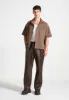 Serge - Relaxed Fit Leather Pleated Trousers - Brown sold by Maniere De Voir