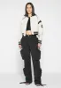 Eiffel Varsity Jacket - Beige sold by Maniere De Voir