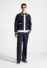 Pierre - Relaxed Fit Twin Pleat Tailored Trousers - Navy sold by Maniere De Voir