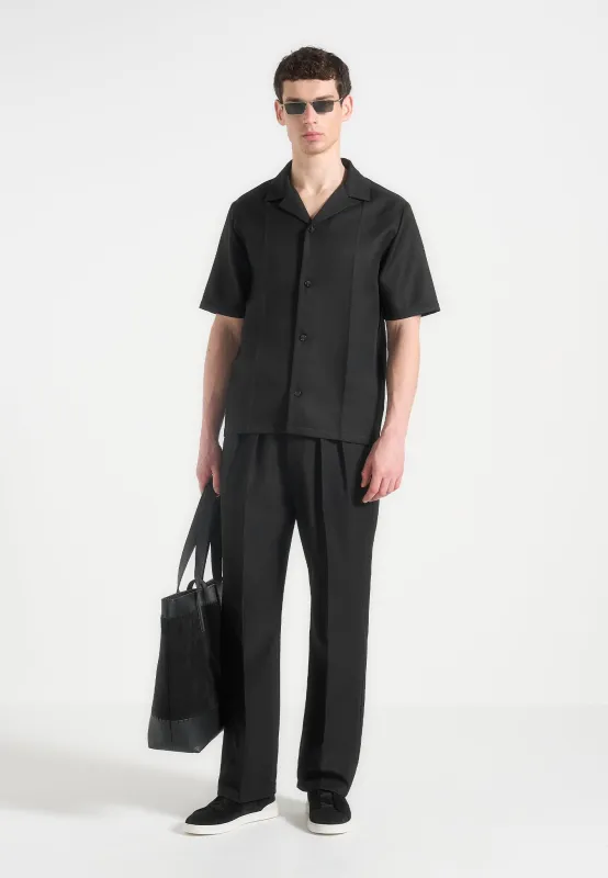 Pierre - Relaxed Fit Twin Pleat Tailored Trousers - Black sold by Maniere De Voir