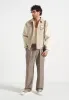 Pierre - Relaxed Fit Textured Pleated Tailored Trousers - Taupe sold by Maniere De Voir