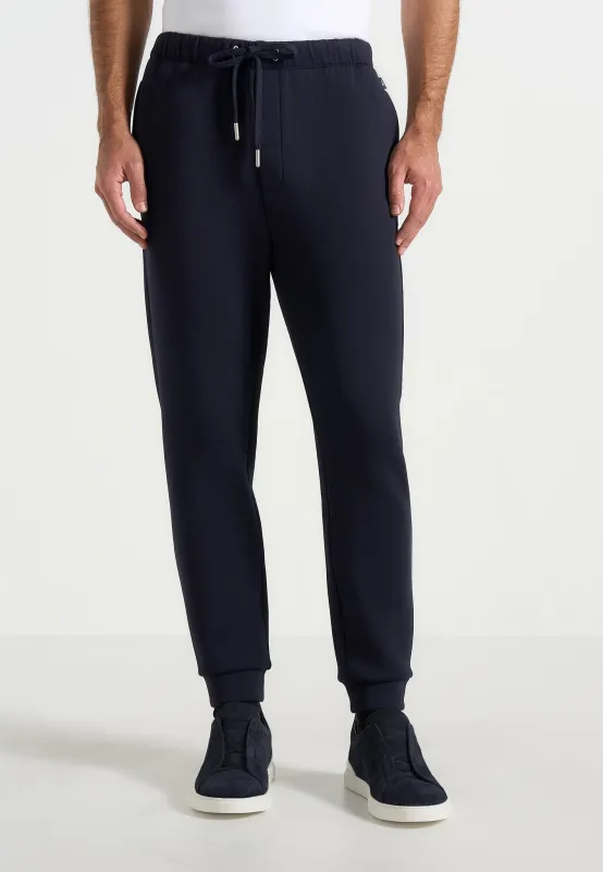Dion - Neoprene Minimal Tapered Fit Cuffed Joggers - Navy sold by Maniere De Voir