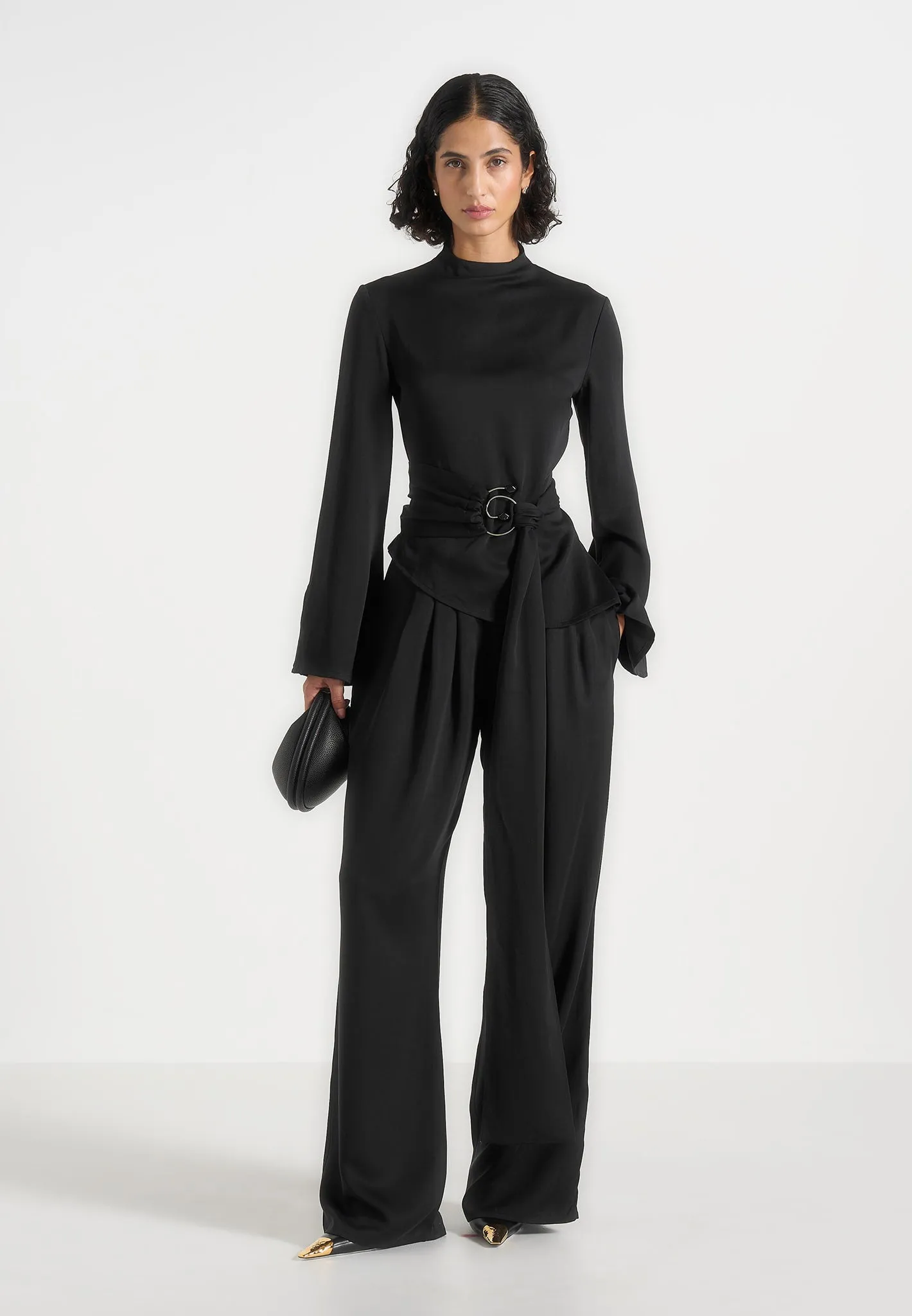 Aurore - Mock Neck Ring Belt Pleated Leg Jumpsuit - Black sold by Maniere De Voir