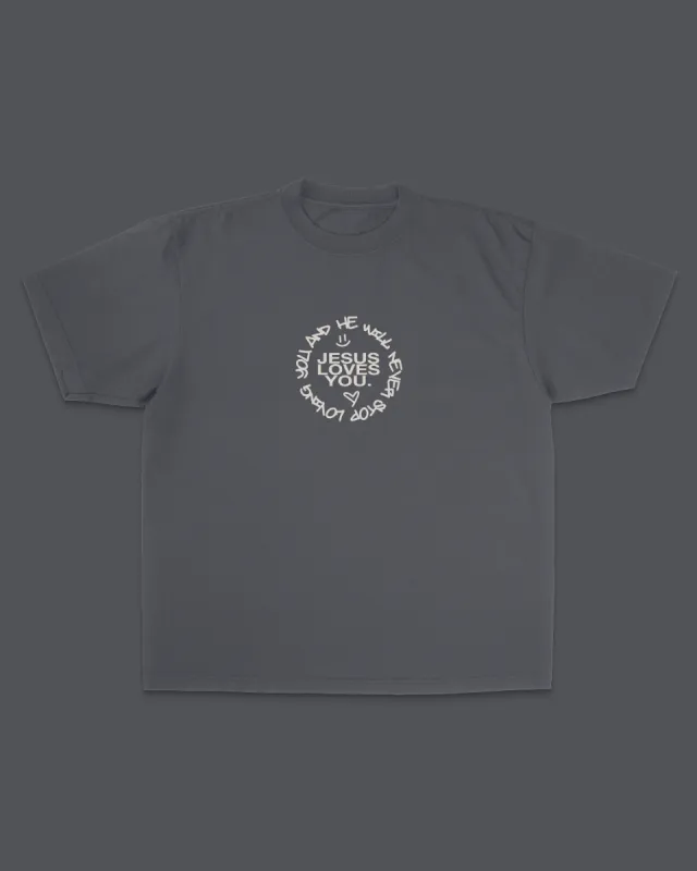 "Love Doesn't Stop" Tee || Charcoal sold by Jesus Loves You