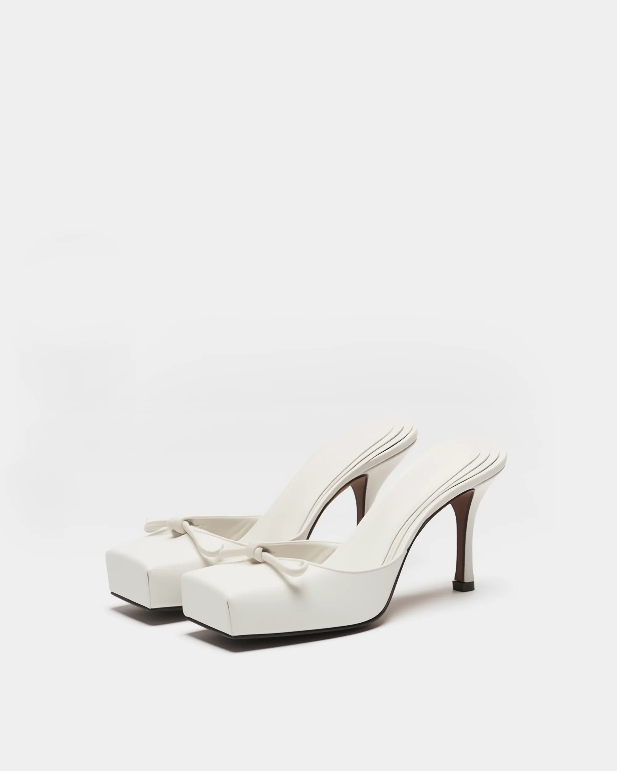 Isla Bow Mules - White sold by JW PEI