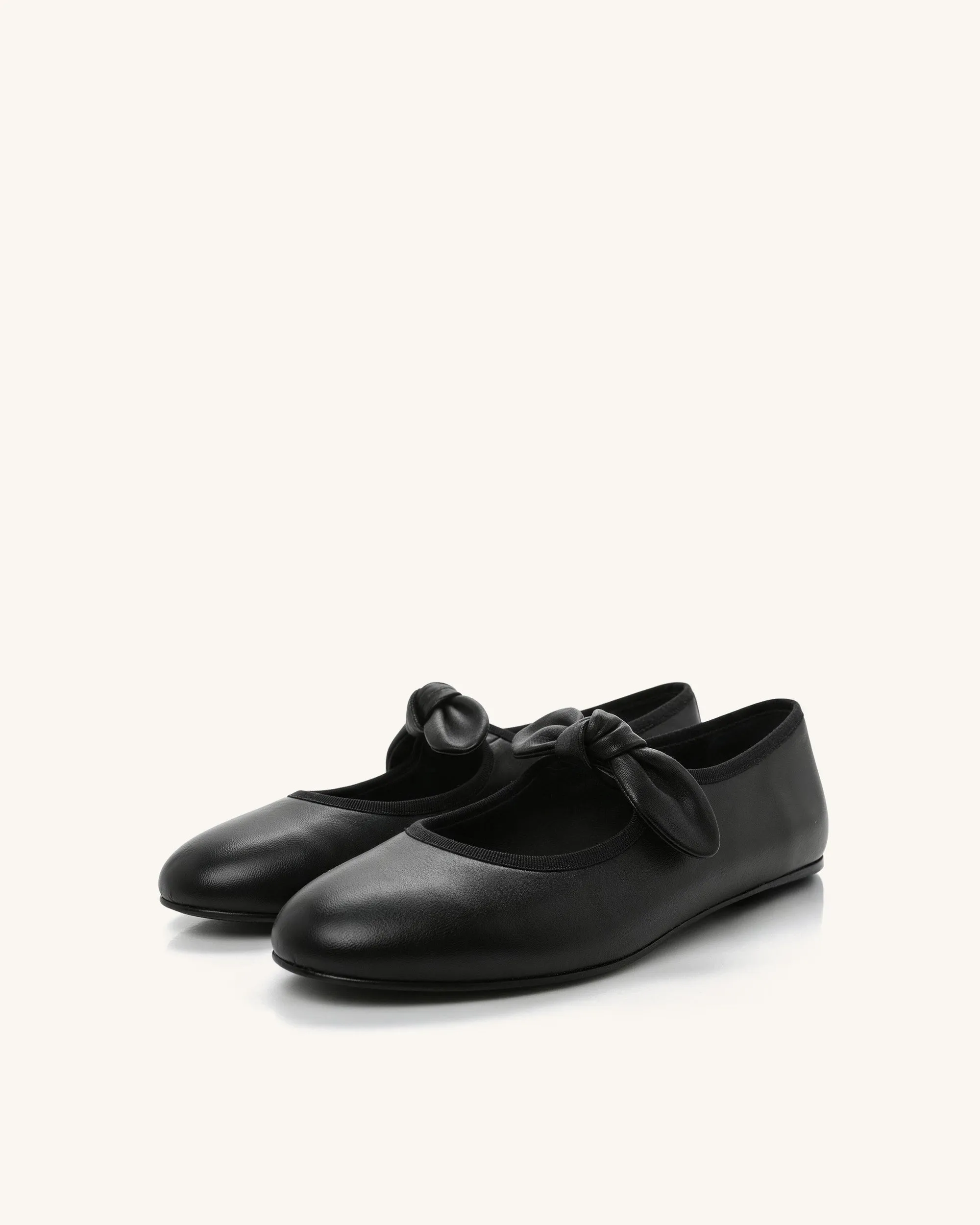Ella Bow Mary Janes – Black sold by JW PEI