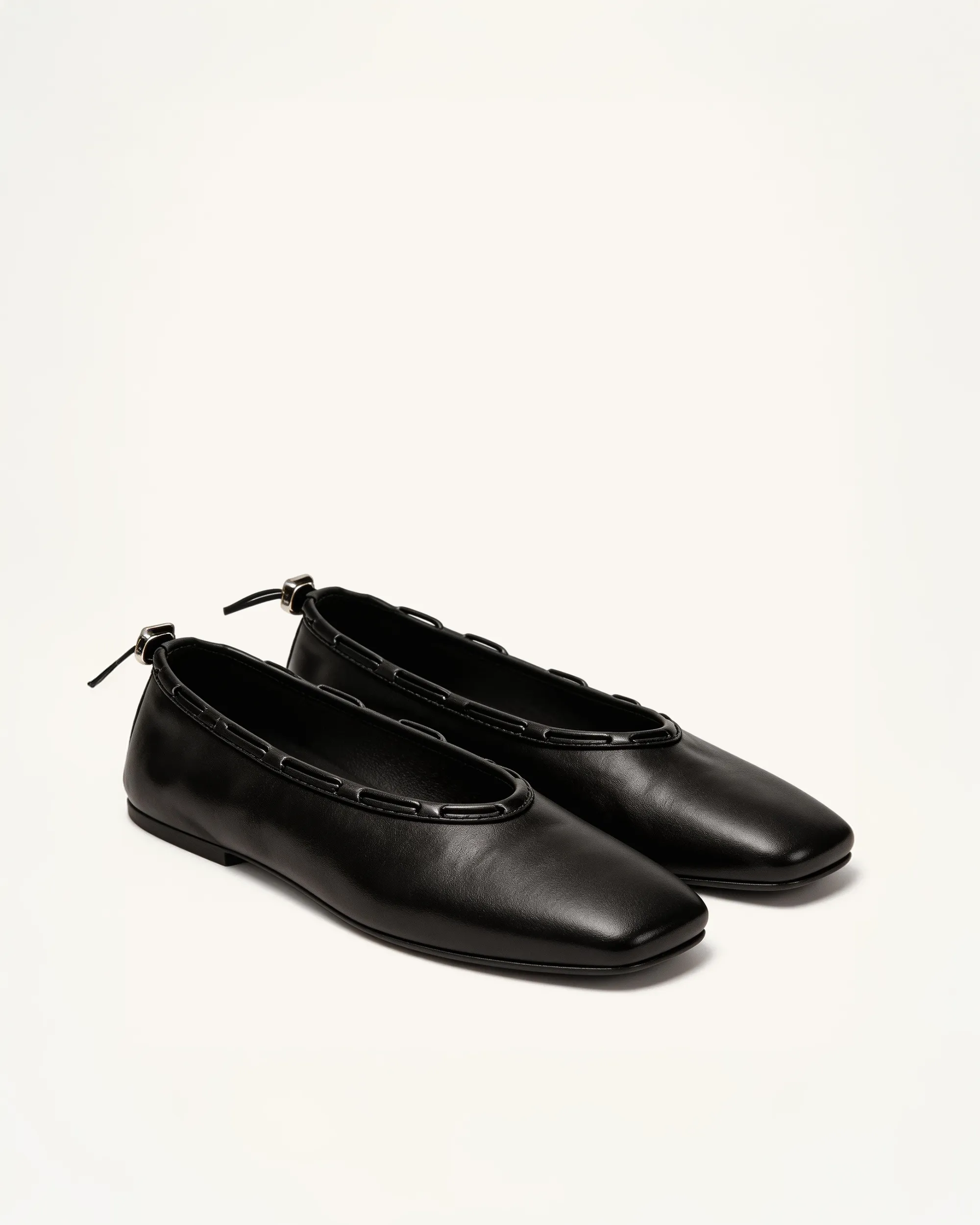 Chloe Chain Flats – Black sold by JW PEI