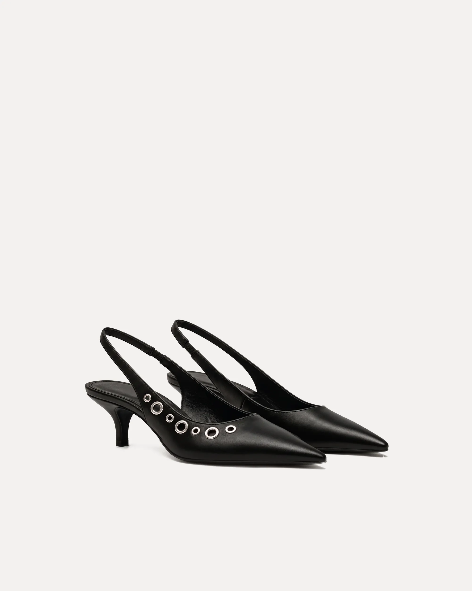 Ava Eyelet Slingback Pumps – Black sold by JW PEI