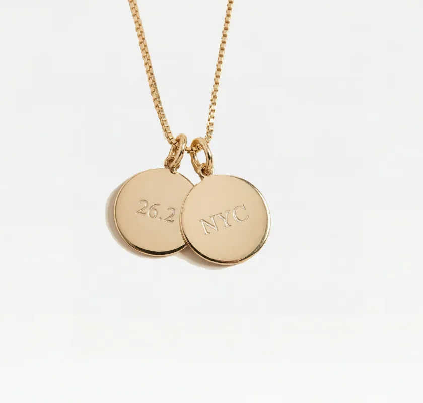 The Engraved Marathon Charm Necklace sold by The M Jewelers