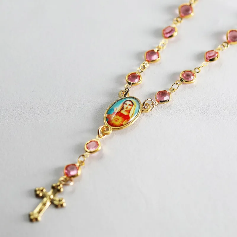 The Pink Crystal Rosary Necklace sold by The M Jewelers