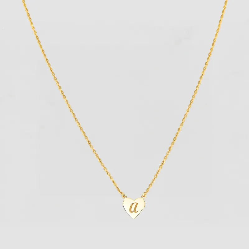 The Script Engraved Heart Letter Necklace sold by The M Jewelers
