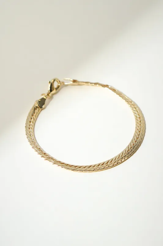 The Knitted Cuban Link Bracelet sold by The M Jewelers