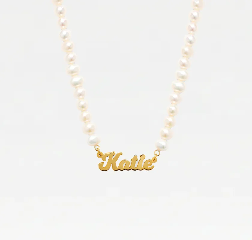 The Pearl Nameplate Necklace sold by The M Jewelers