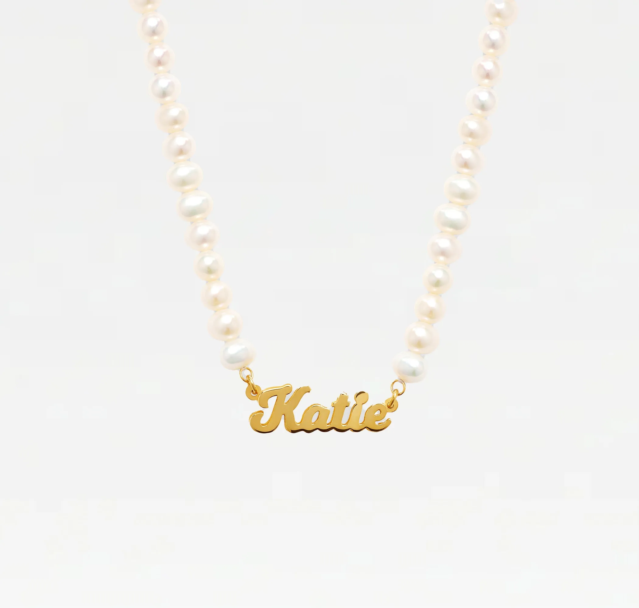 The Pearl Nameplate Necklace sold by The M Jewelers