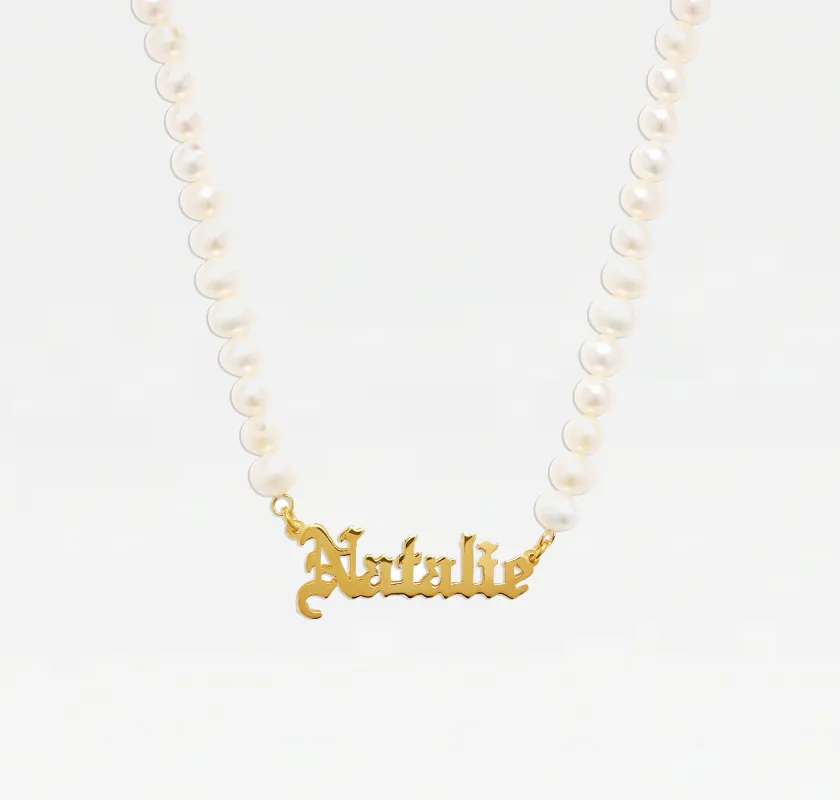 The Old English Pearl Nameplate Necklace sold by The M Jewelers