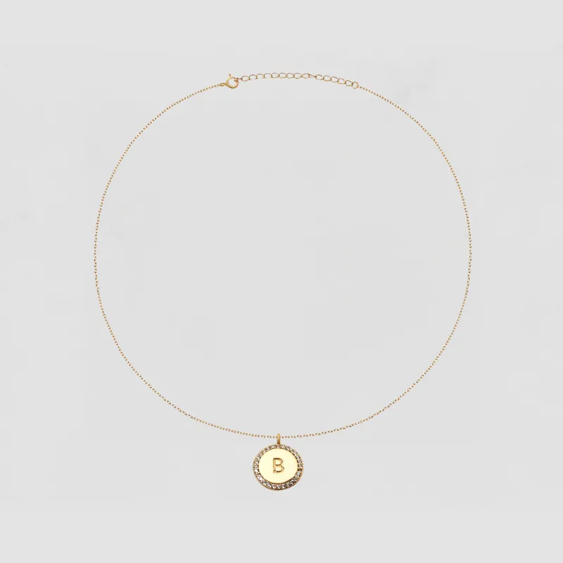 The Block Pave Initial Disc Necklace sold by The M Jewelers