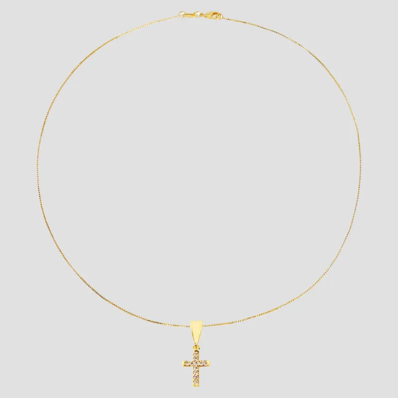 The Tiny Pavé Gold Filled Cross sold by The M Jewelers