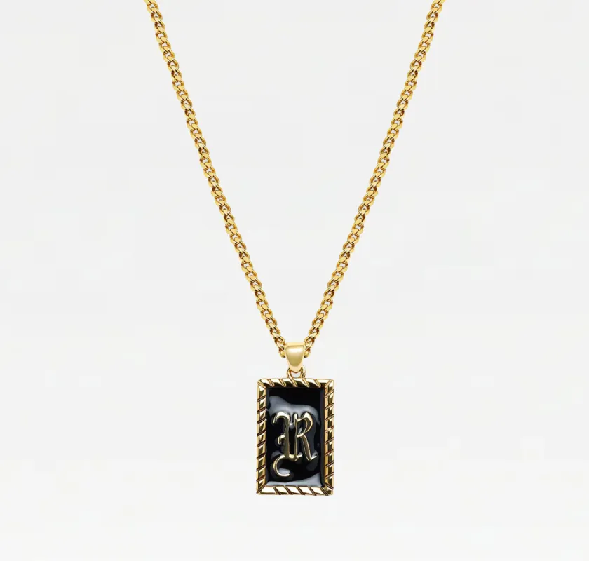 The Enamel Initial Pendant sold by The M Jewelers