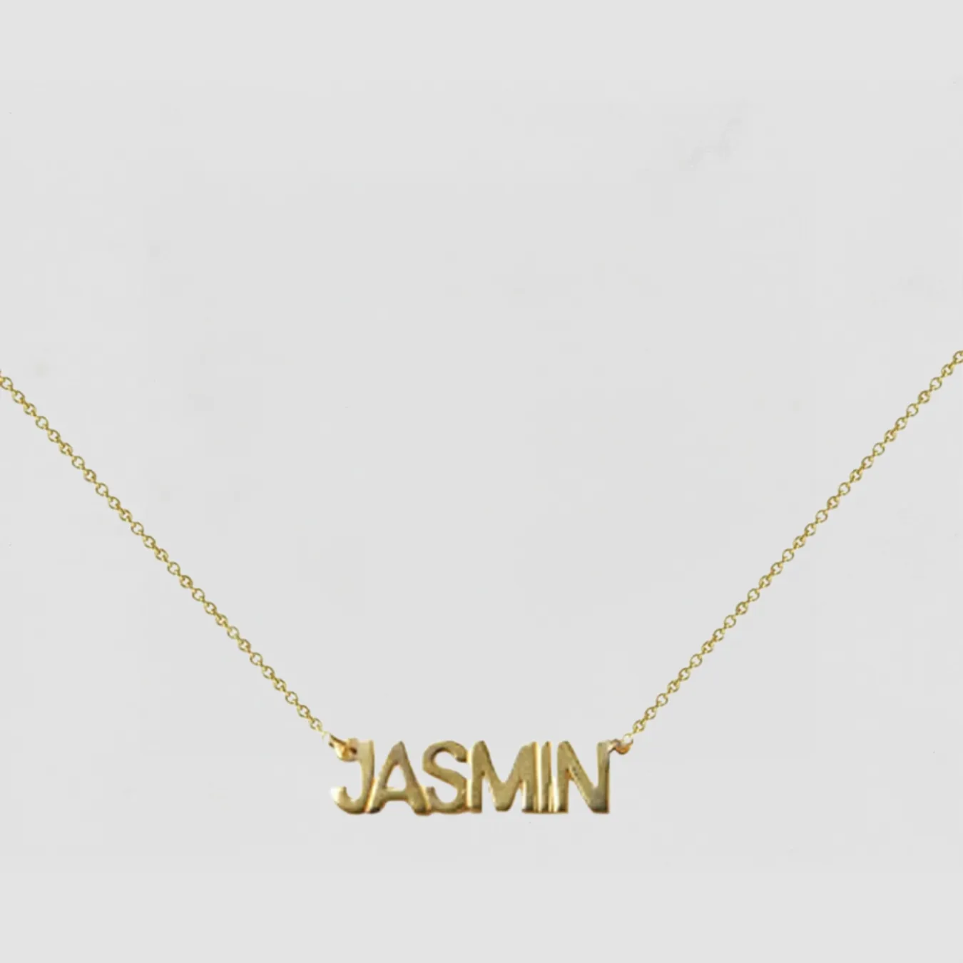 The Block Nameplate Uppercase sold by The M Jewelers