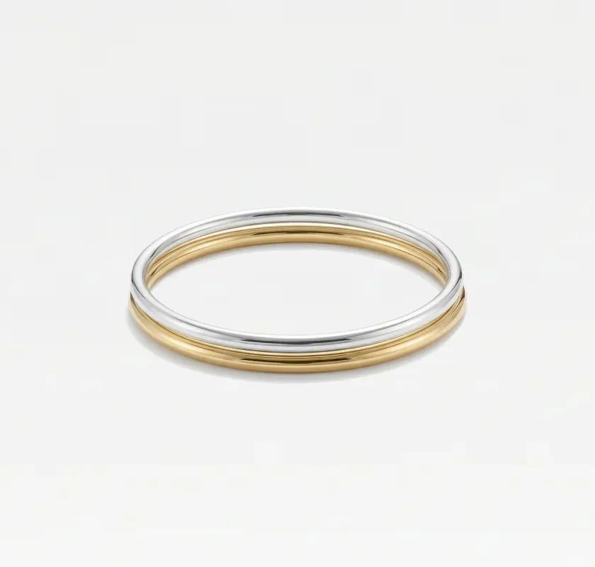 THE TWO TONE BANGLE SET sold by The M Jewelers