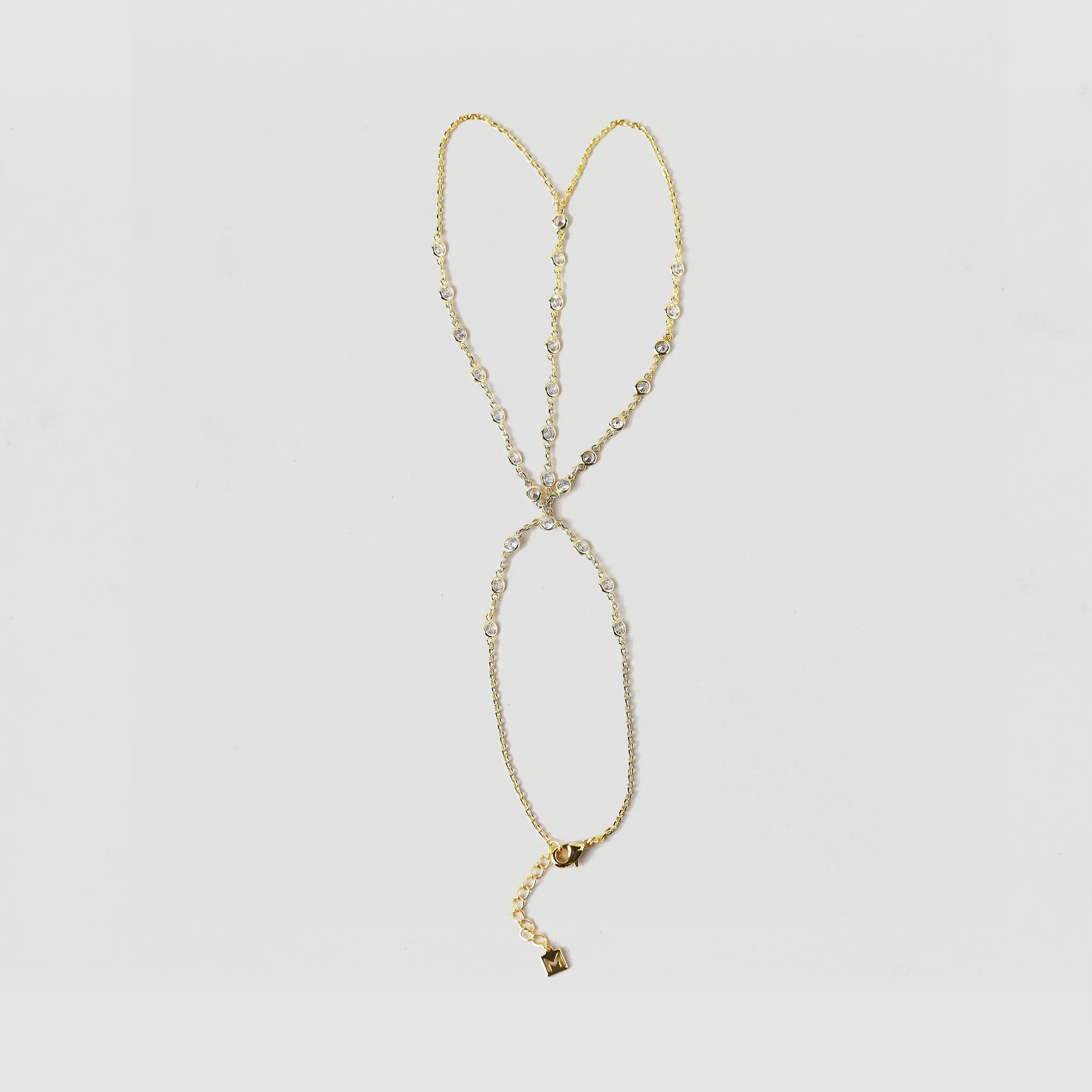 The Heirloom Bezel Hand Chain sold by The M Jewelers
